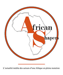 African Shapers logo is a gray outline of the continent of Africa which is used as a clipping path for the first letter of each word ('A' and 'S') which are also much larger than the other letters, colored burnt sienna and nearly filling the continent of Africa. The 'A' is in the top left and the 'S' in the bottom right. There is a slight overlap in line height. The font is a thin serif font. The rest of the smaller black letters are allowed to overflow out of the clipping path and in fact 'Shapers' is allowed to overflow outside of the burnt sienna thick round border that is encircling the continent. The border itself is outlined on both sides in thin black. The word 'African' is a larger font size than 'Shapers' but the 'A' and 'S' appear to be same height. The word 'Shapers' is below 'African' and offset to the right.